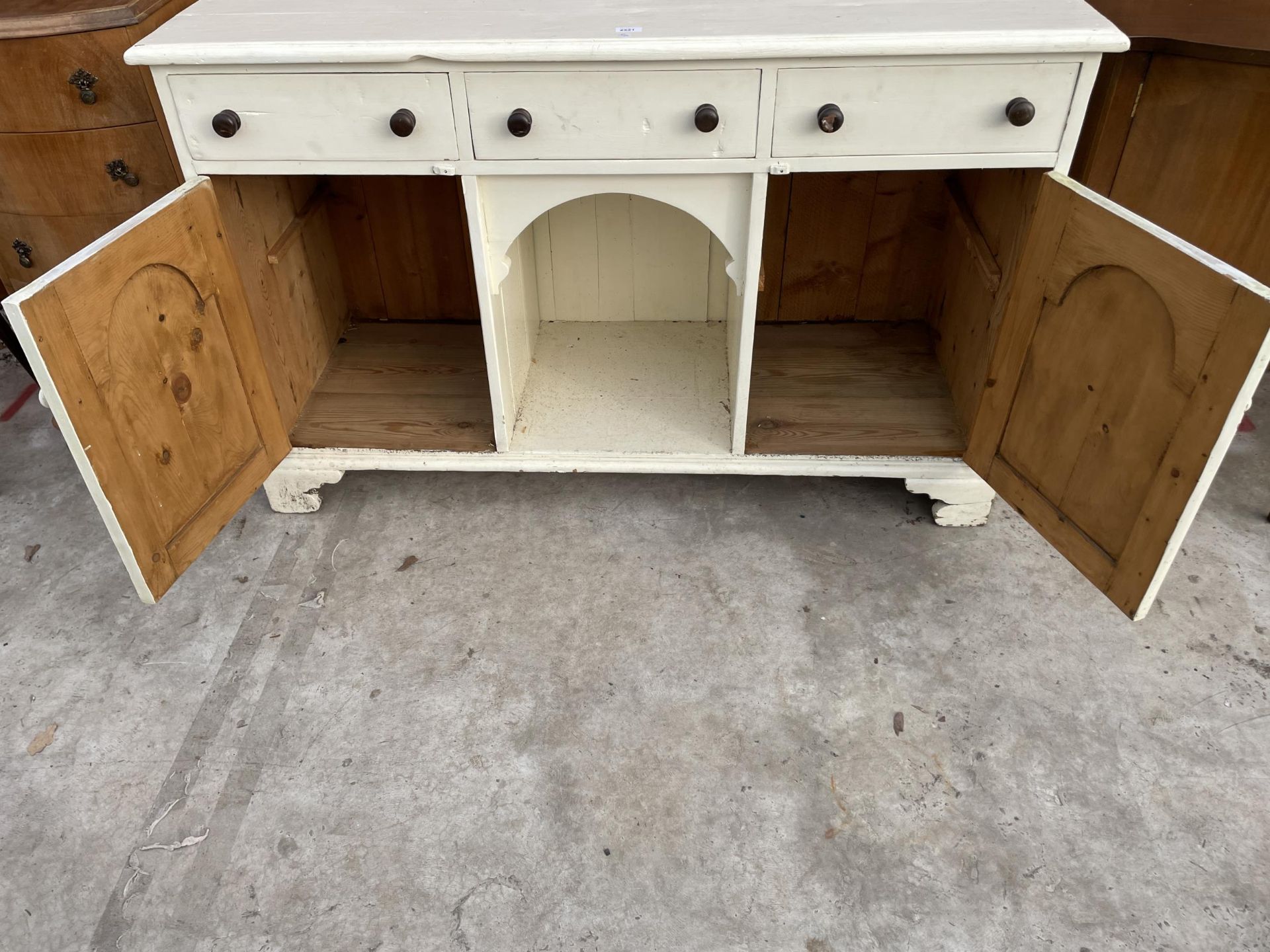 A VICTORIAN STYLE PINE KITCHEN DRESSER BASE ENCASING THREE DRAWERS, TWO CUPBOARDS AND AN OPEN - Image 3 of 3