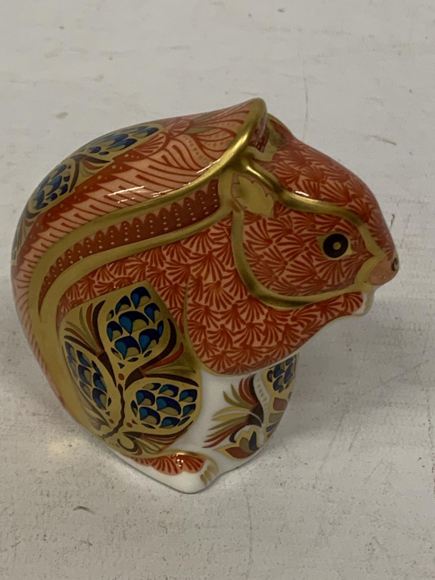 A ROYAL CROWN DERBY SQUIRREL WITH GOLD COLOURED STOPPER