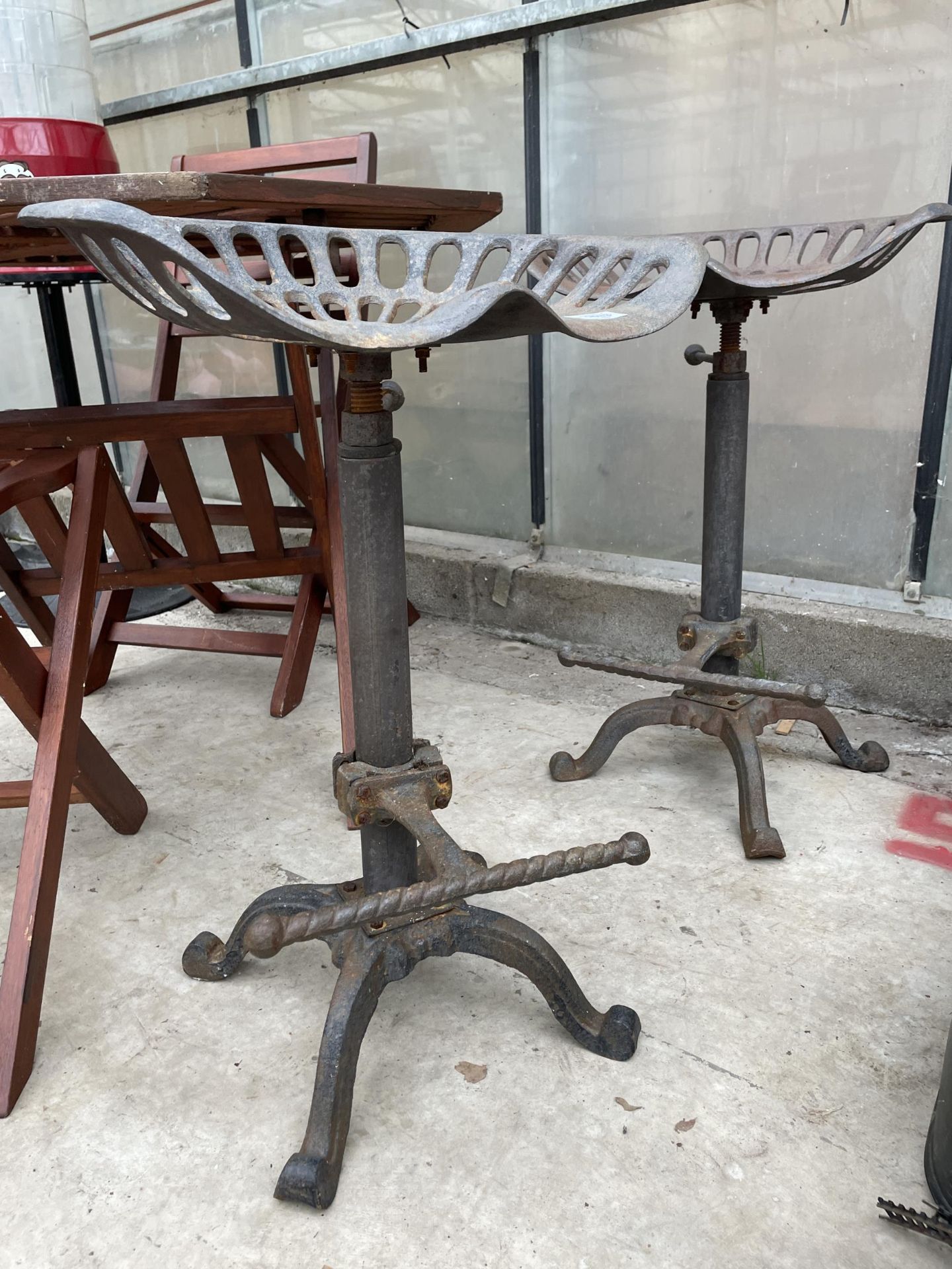 A PAIR OF VINTAGE INDUSTRIAL STYLE STOOLS WITH IMPLEMENT SEATS - Image 2 of 5