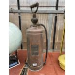 A VINTAGE COPPER FIRE EXTINGUISHER WITH IONDESTINCT PLAQUE