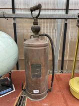 A VINTAGE COPPER FIRE EXTINGUISHER WITH IONDESTINCT PLAQUE