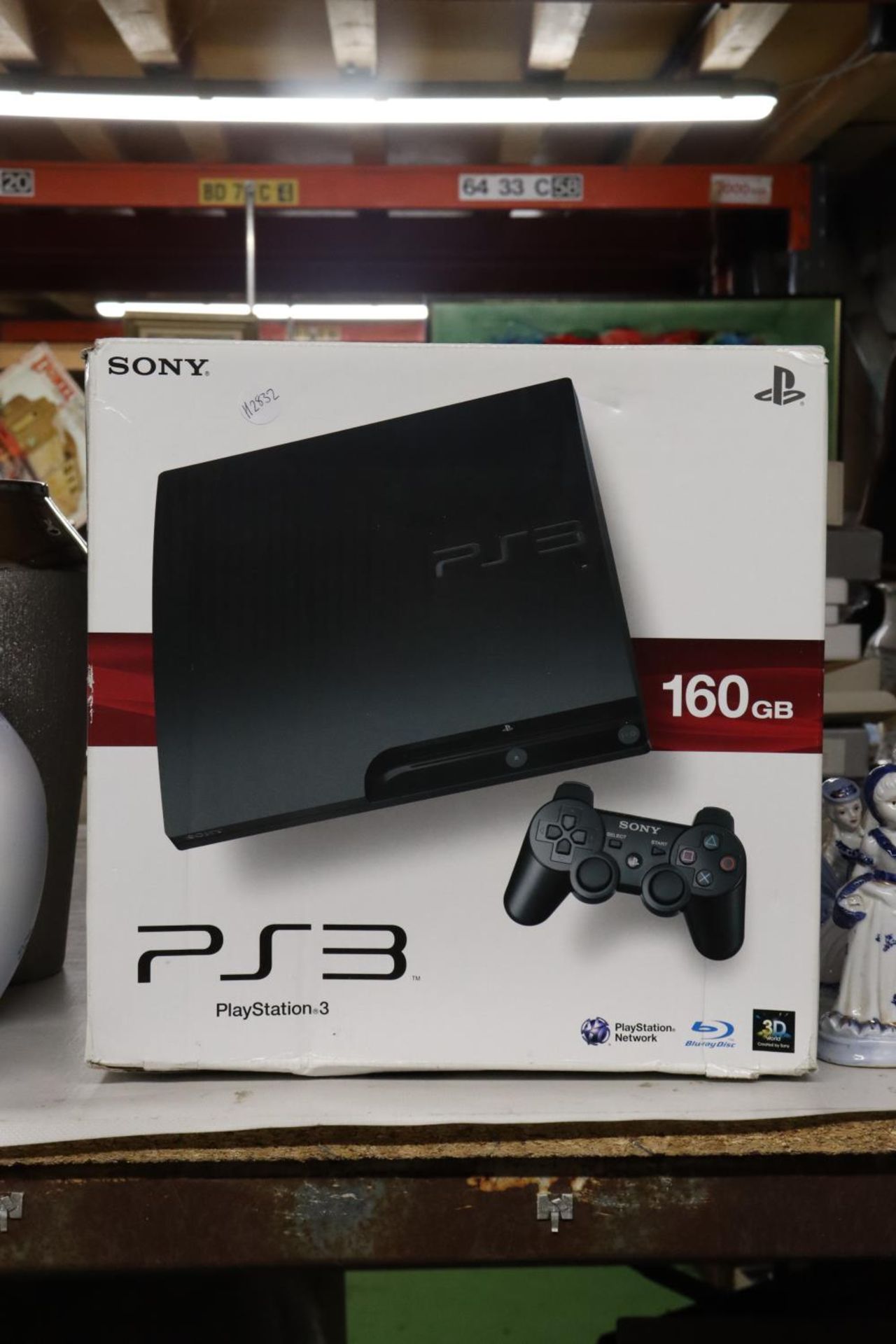 A BOXED PLAYSTATION 3, 160 GB WITH A CONTROLLER AND POWER CABLE
