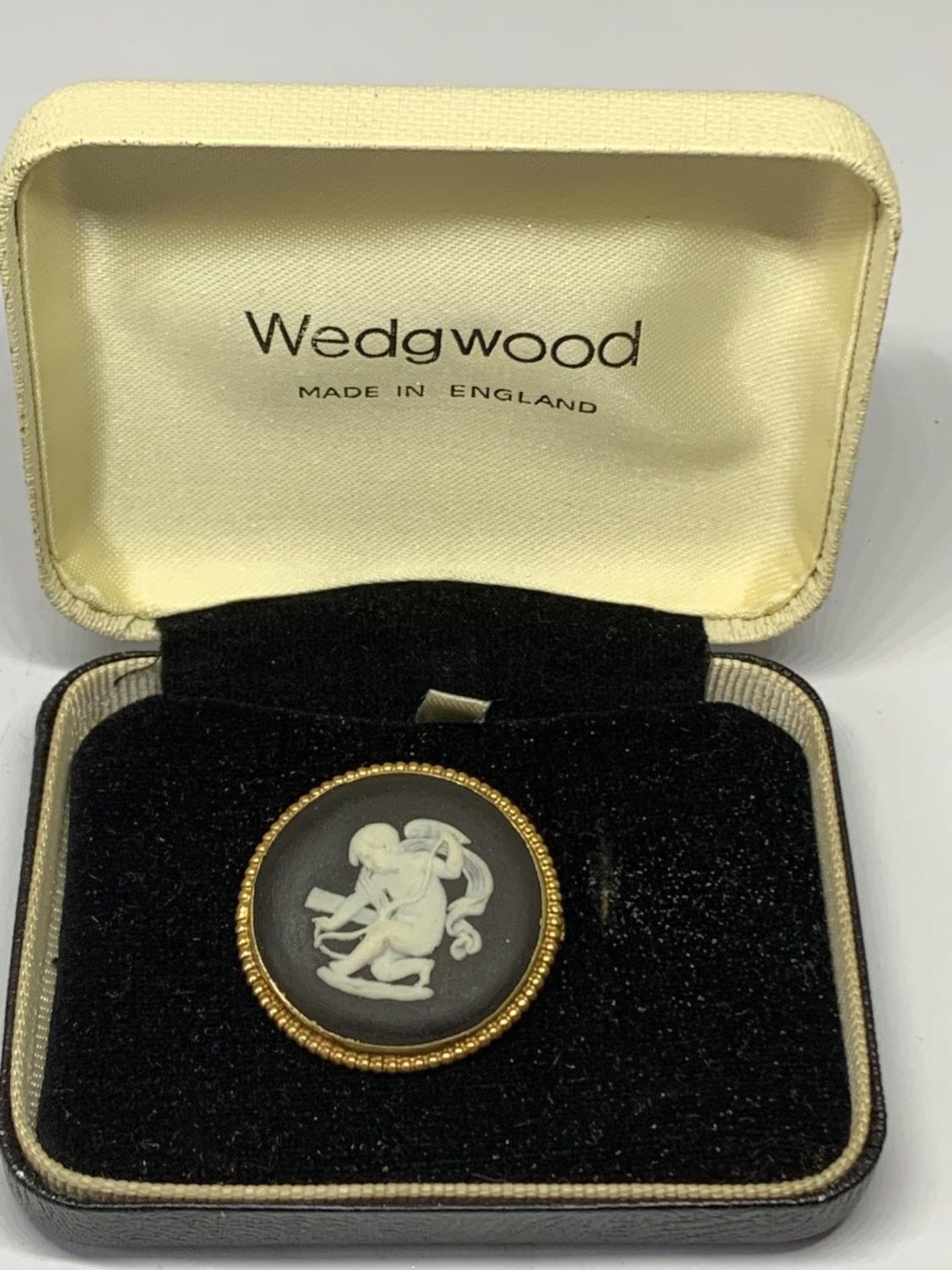 A BLACK AND WHITE WEDGWOOD JASPERWARE BROOCH