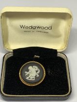 A BLACK AND WHITE WEDGWOOD JASPERWARE BROOCH