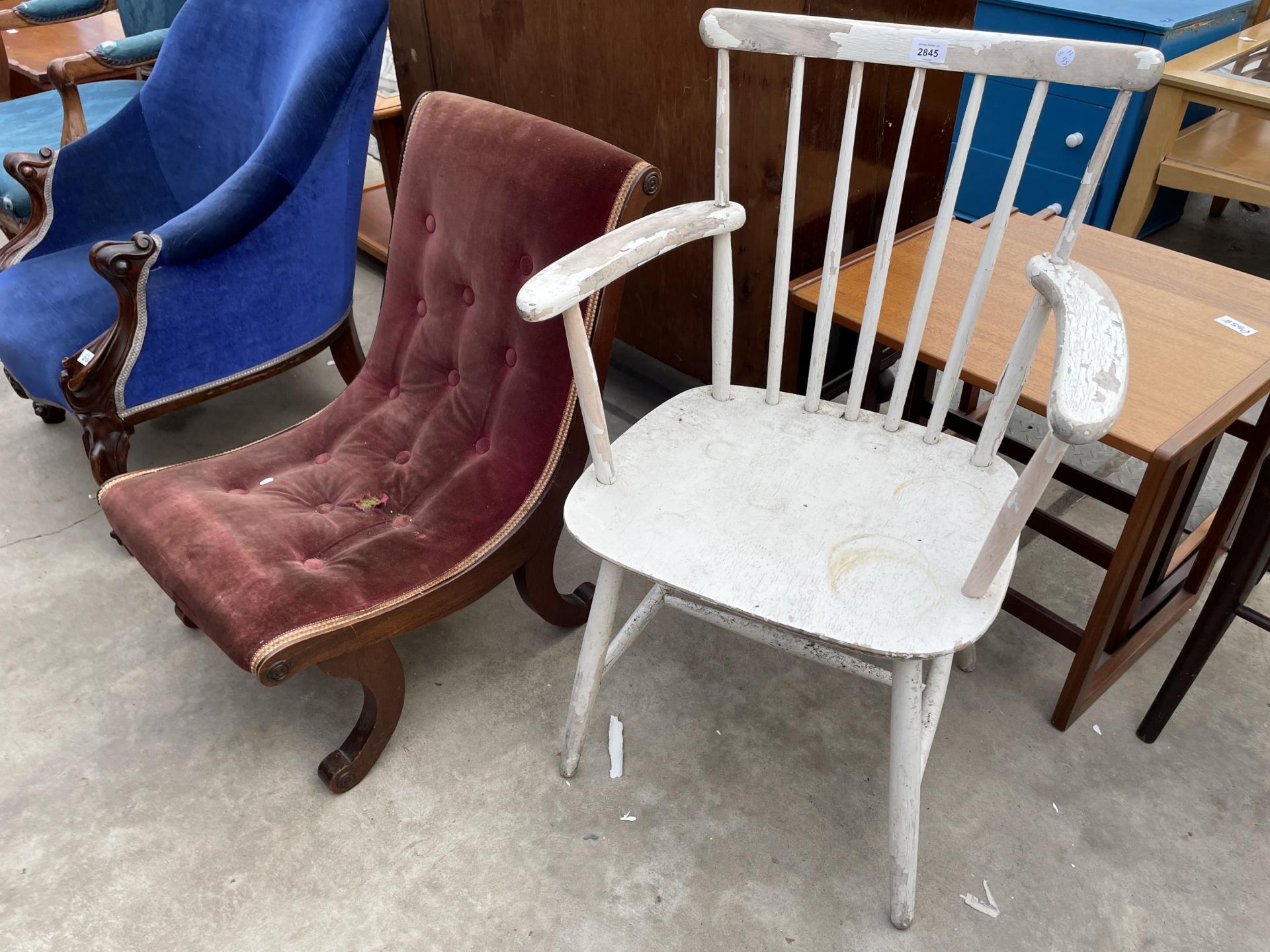 A WHITE ERCOL STYLE ELBOW CHAIR AND A BUTTON BACK VICTORIAN STYLE NURSING CHAIR ON SCROLL LEGS