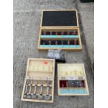 AN ASSORTMENT OF CASED ROUTER BITS