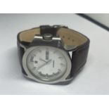 A DIESEL DAY AND DATE WRIST WATCH SEEN WORKING BUT NO WARRANTY
