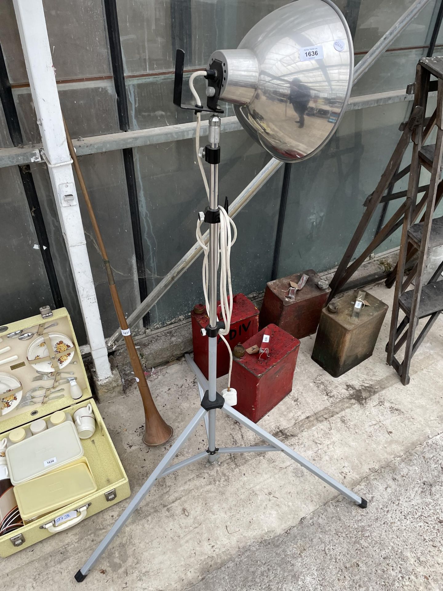 A RETRO INDUSTRIAL STYLE LAMP WITH TRIPOD STAND