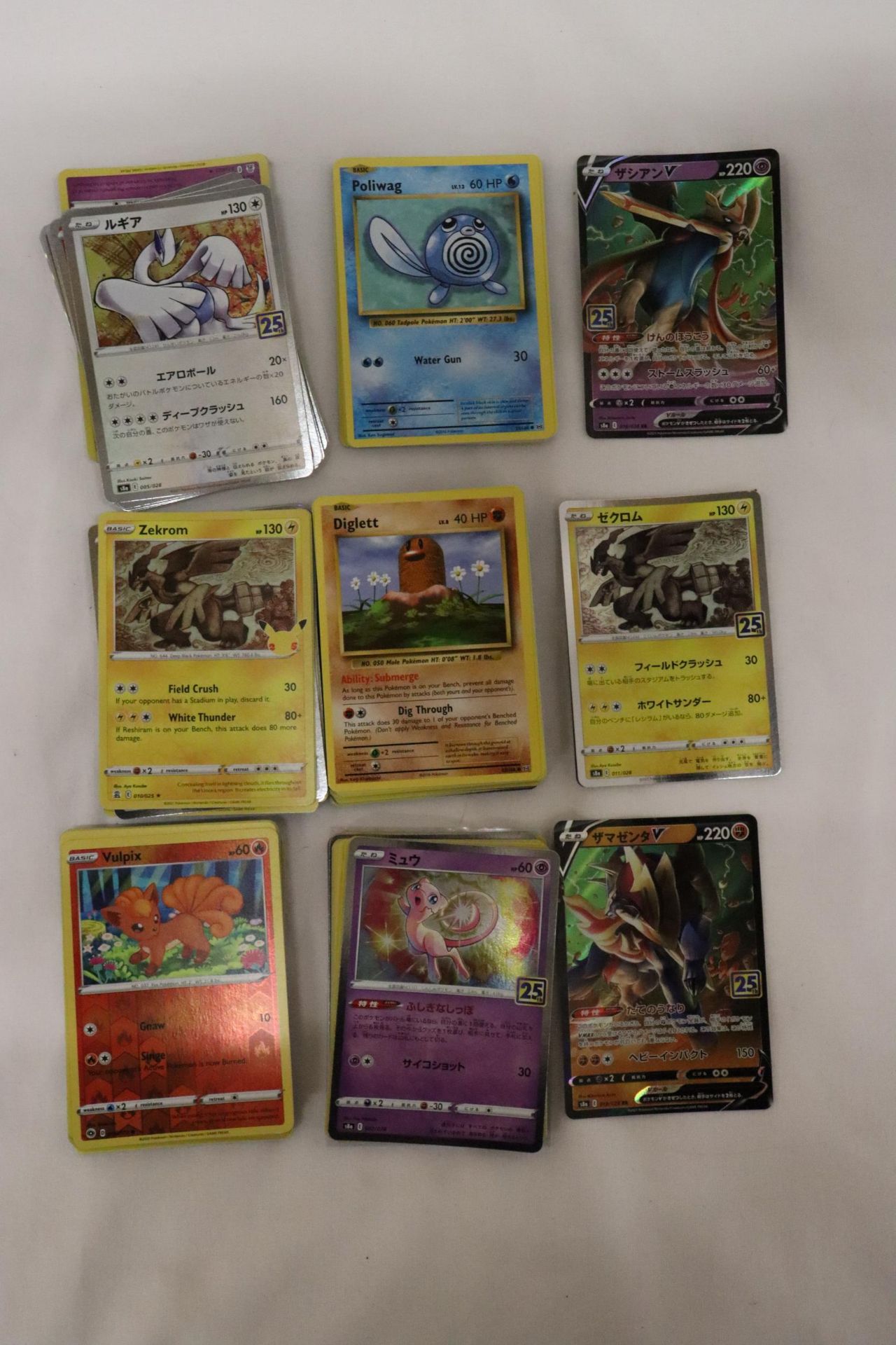 A QUANTITY OF POKEMON CARDS TO INCLUDE JAPANESE