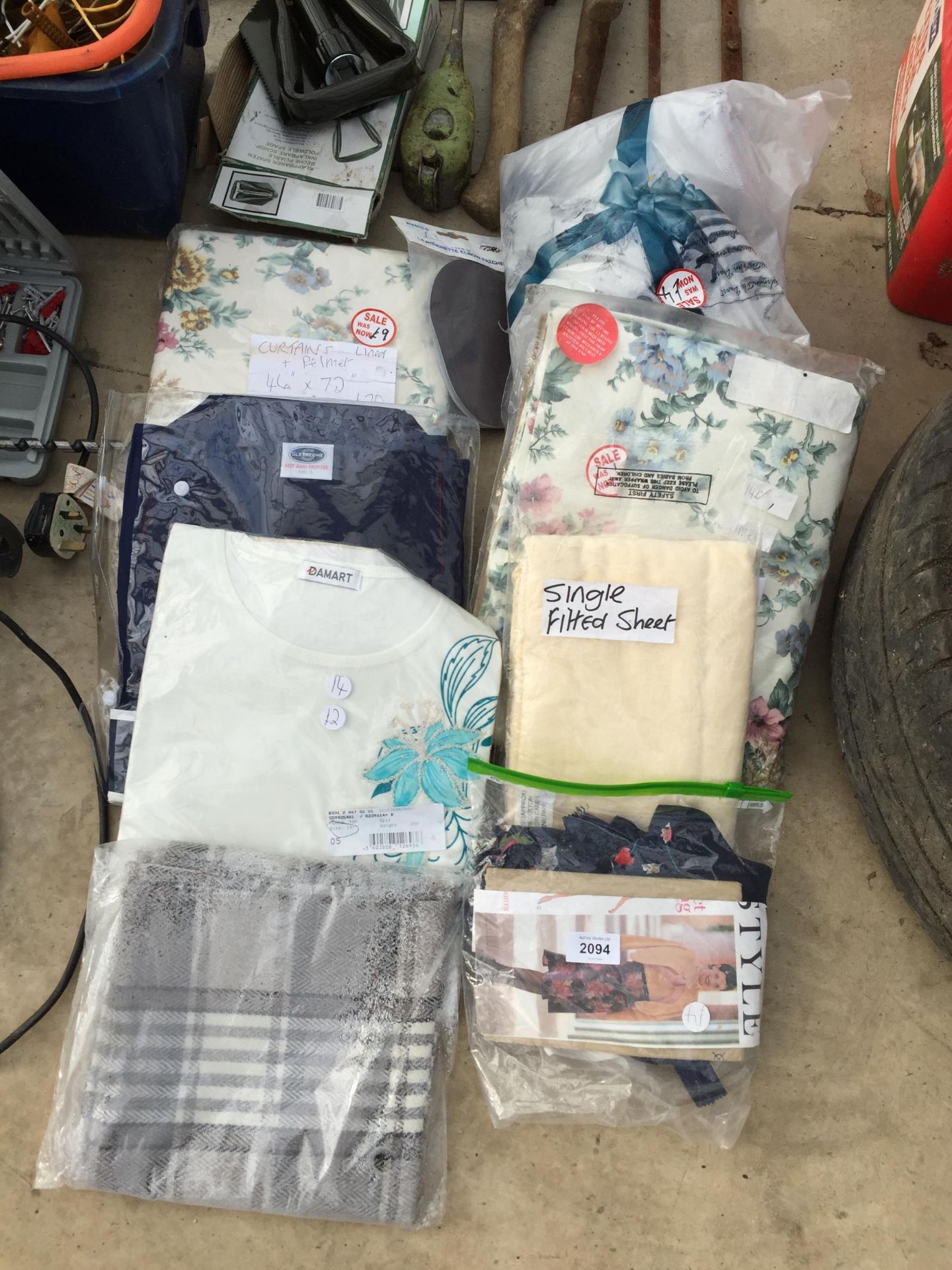 AN ASSORTMENT OF MATERIAL AND CLOTHING ETC
