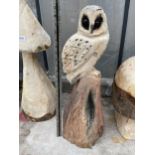 AN OWL CHAINSAW CARVING (H:65CM)