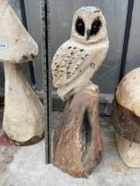 AN OWL CHAINSAW CARVING (H:65CM)