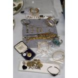A QUANTITY OF COSTUME JEWELLERY TO INCLUDE NECKLACES, BRACELETS, EARRINGS, ETC