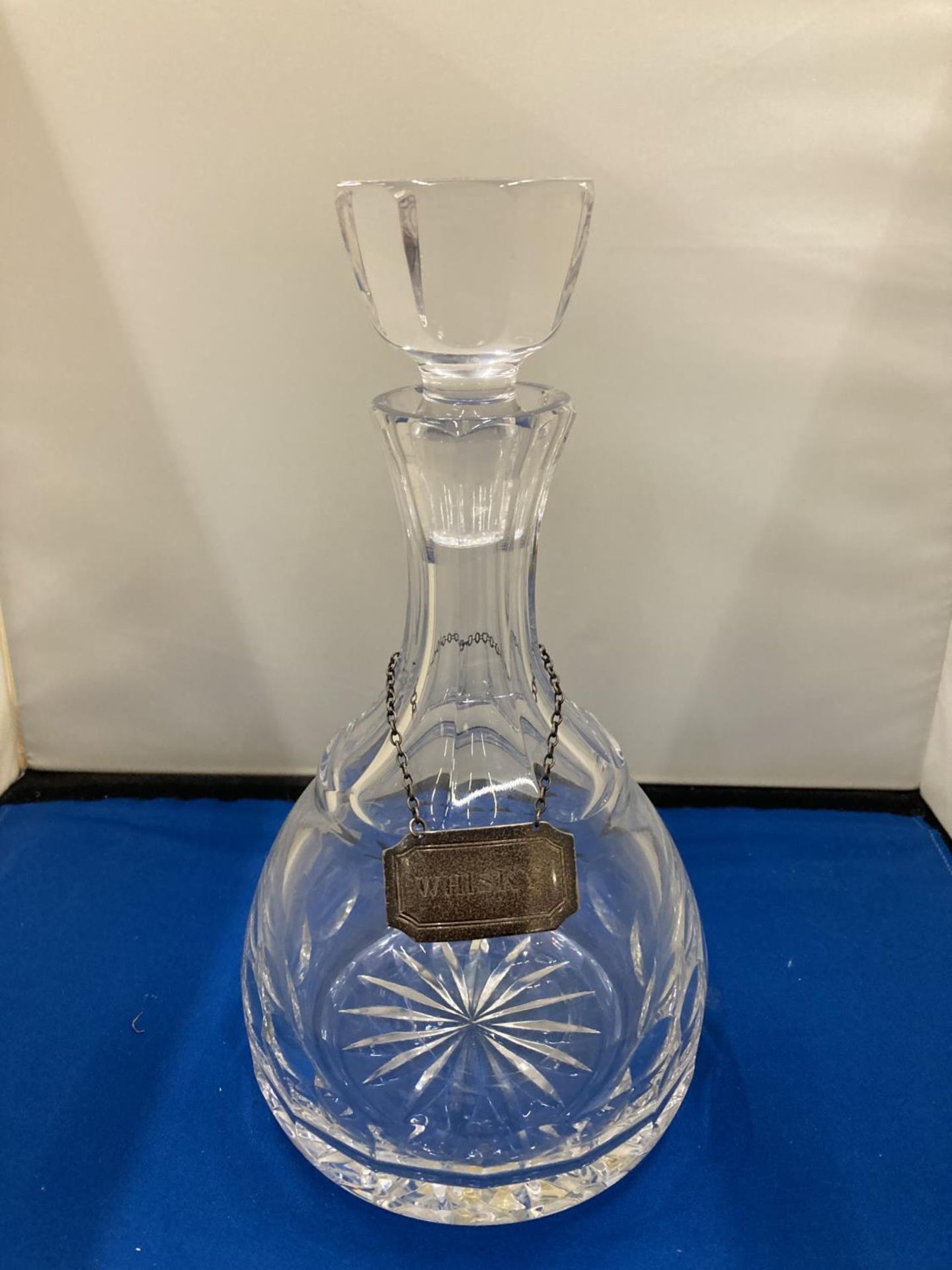 A GLASS DECANTER WITH A HALLMARKED BIRMINGHAM SILVER WHISKY LABEL