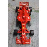 A LARGE FORMULA ONE FERRARI RACING CAR 37 INCH LONG