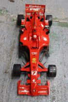 A LARGE FORMULA ONE FERRARI RACING CAR 37 INCH LONG