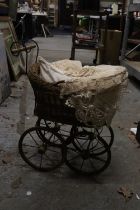 A VICTORIAN CHILD'S PRAM WITH LACE COVERS
