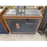 A VINTAGE GLASS FRONTED SHOP DISPLAY UNIT