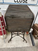 A VINTAGE WOODEN MACHINE TYPISTS CABINET WITH TAMBOUR FALL FRONT SHUTTER