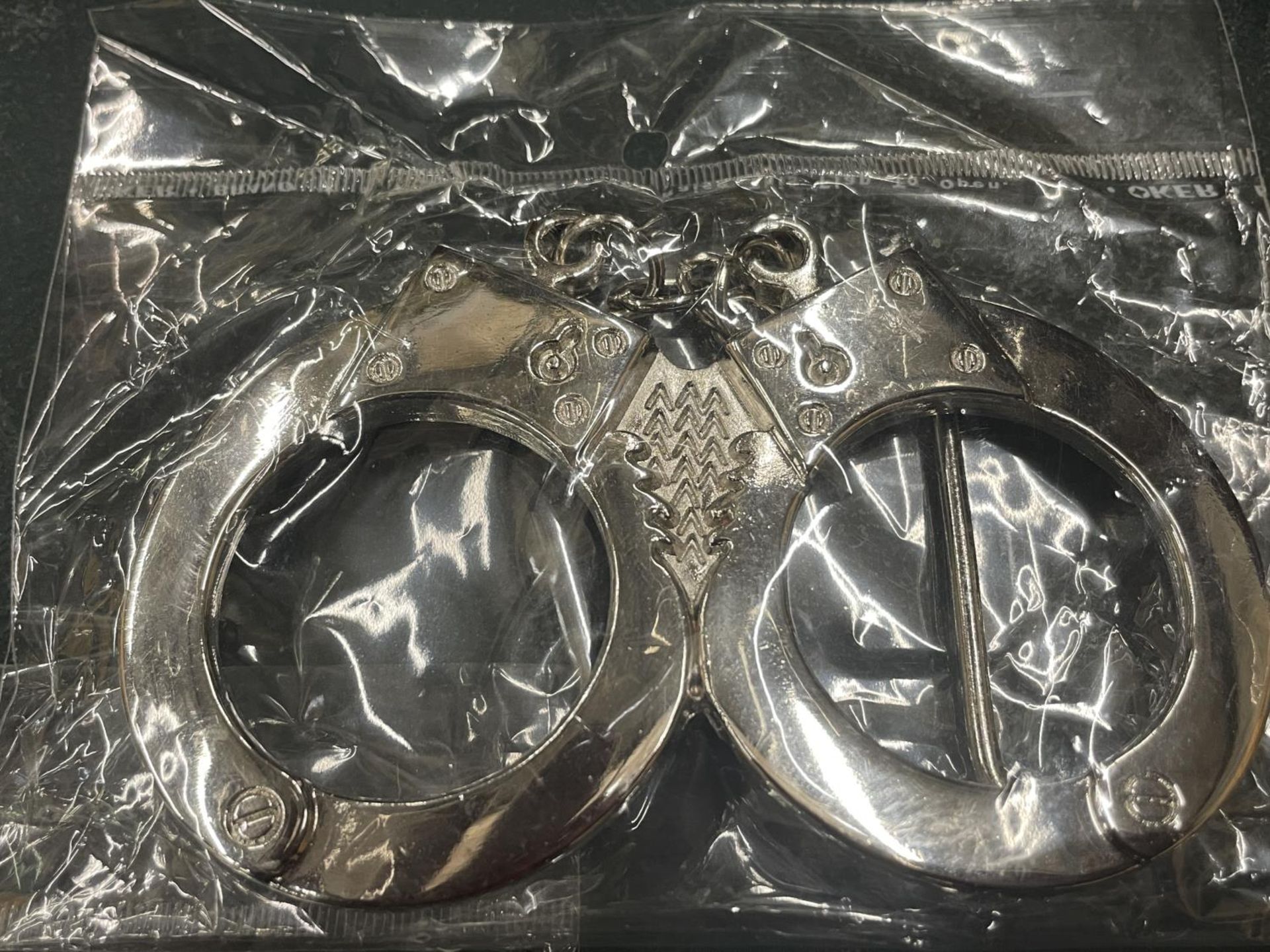 FOUR ENAMEL AND CHROME BELT BUCKLES TO INCLUDE HAND CUFFS - Image 5 of 5