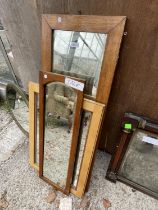 AN OAK FRAMED WALL MIRROR AND TWO OTHERS
