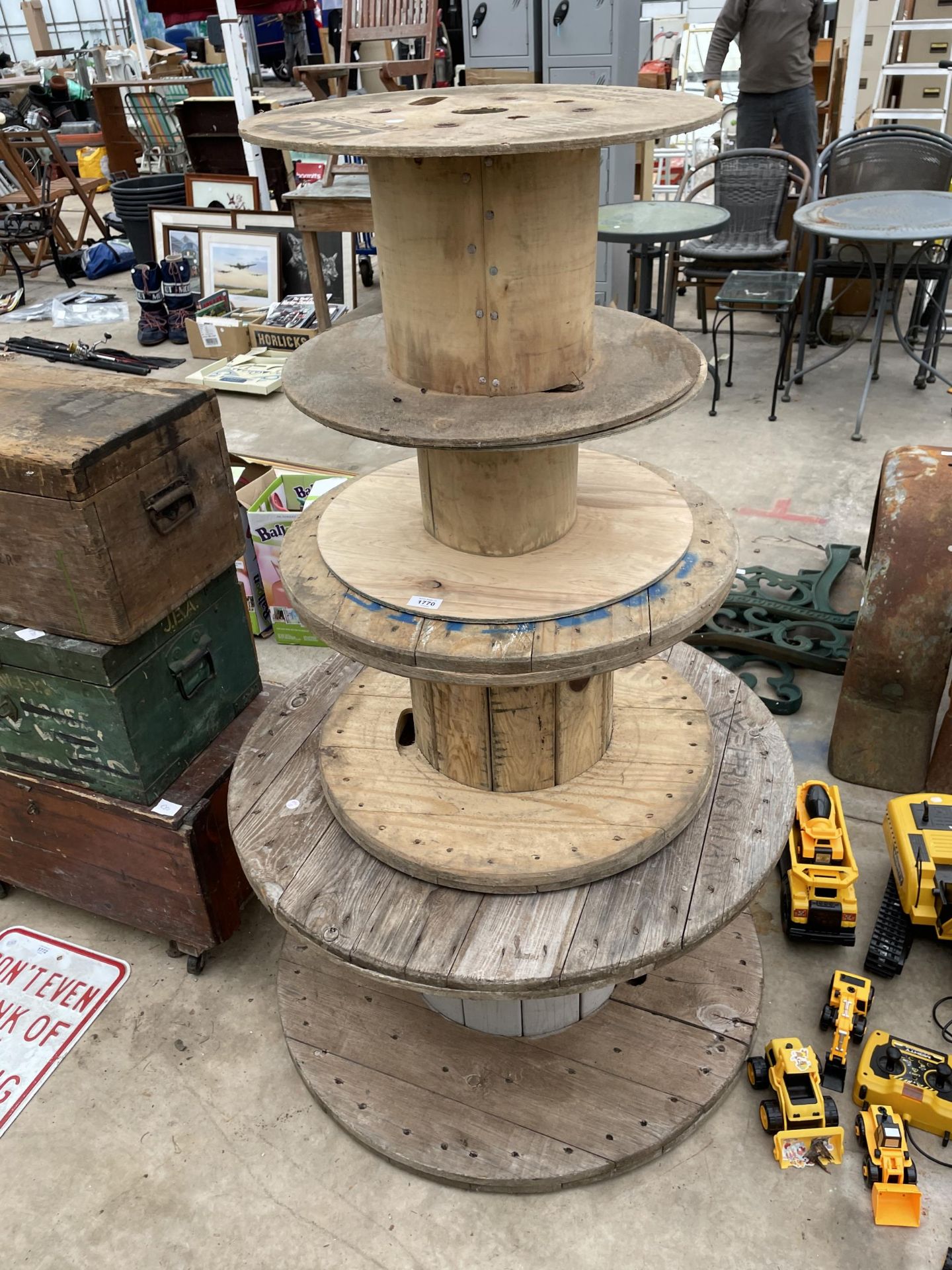 FOUR GRADUATED WOODEN CABLE REELS