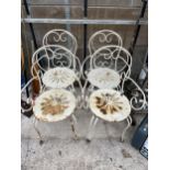 A SET OF FOUR DECORATIVE METAL GARDEN BISTRO CHAIRS