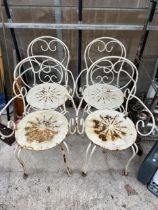 A SET OF FOUR DECORATIVE METAL GARDEN BISTRO CHAIRS