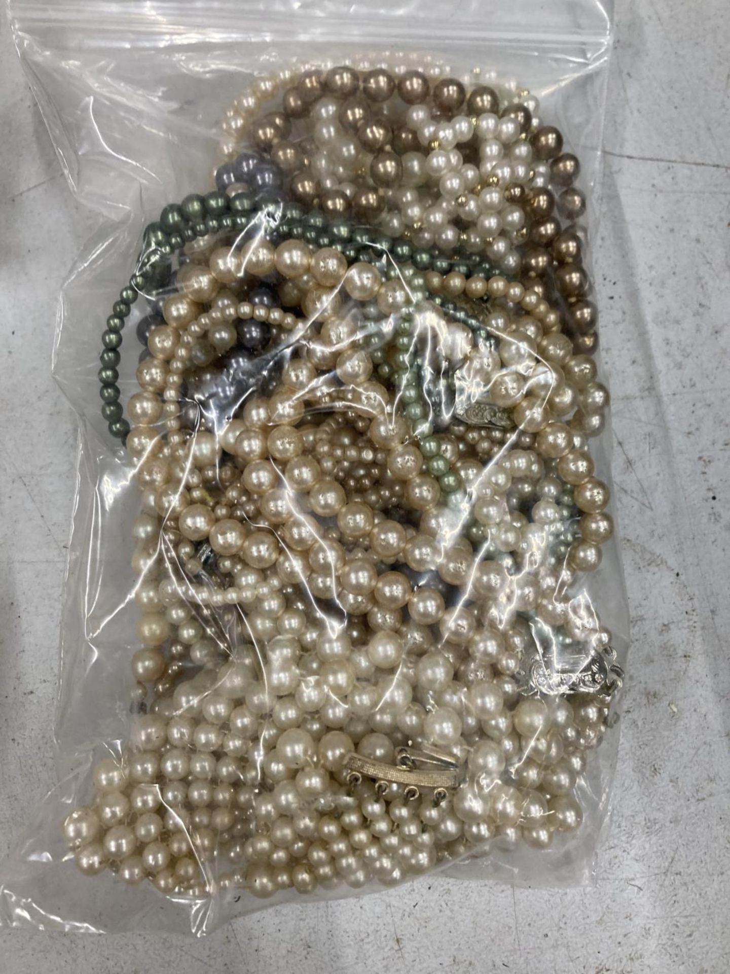 A LARGE QUANTITY OF PEARL NECKLACES