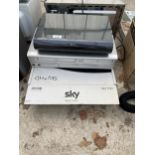 A SKY BOX AND A DURABAND VHS DVD PLAYER