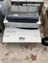 A SKY BOX AND A DURABAND VHS DVD PLAYER