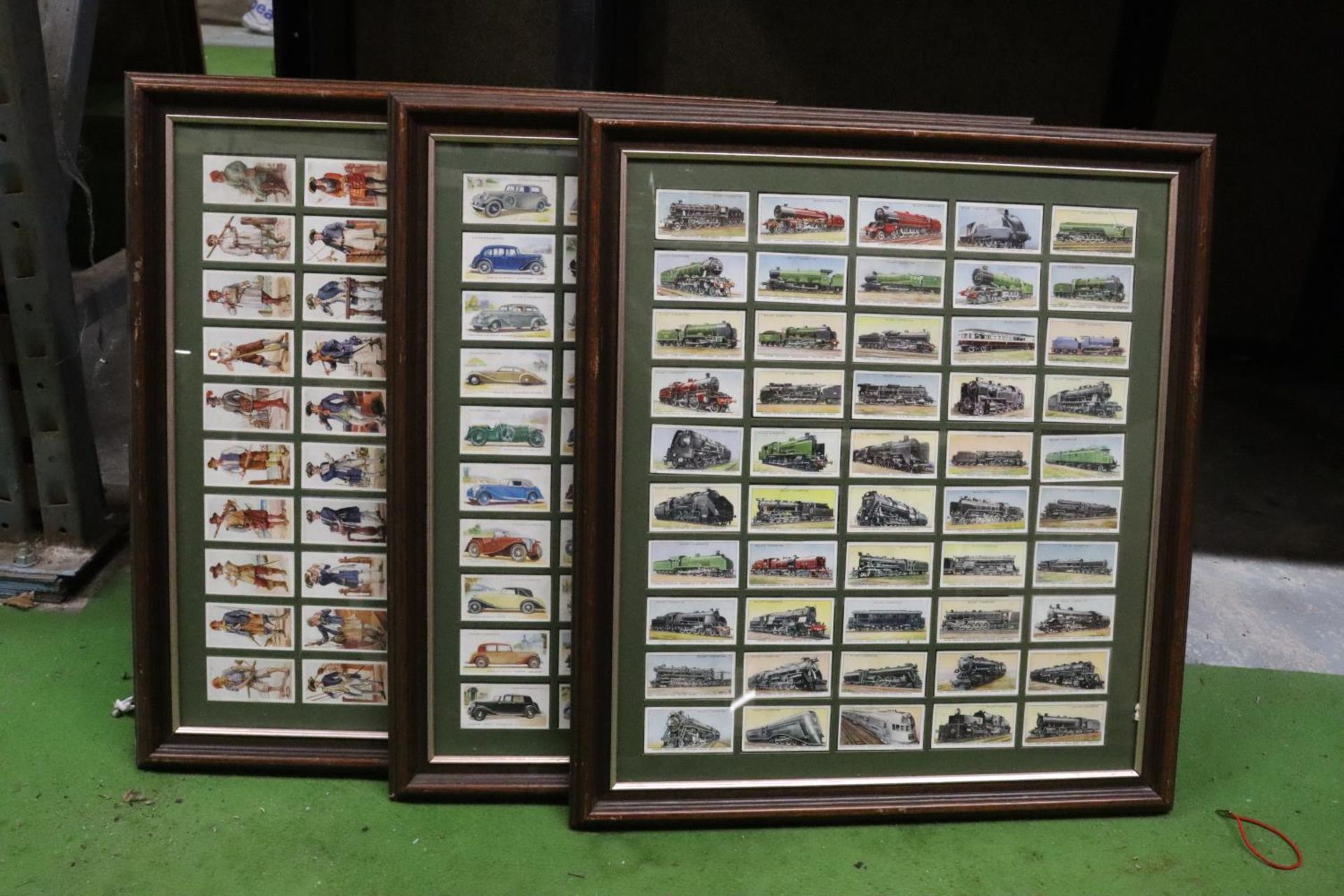 THREE FRAMED COLLECTIONS OF TRAINS, CARS AND NAVAL UNIFORMS