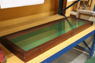 A LONG GREEN BAIZE DISPLAY CABINET 51 X 18 INCH