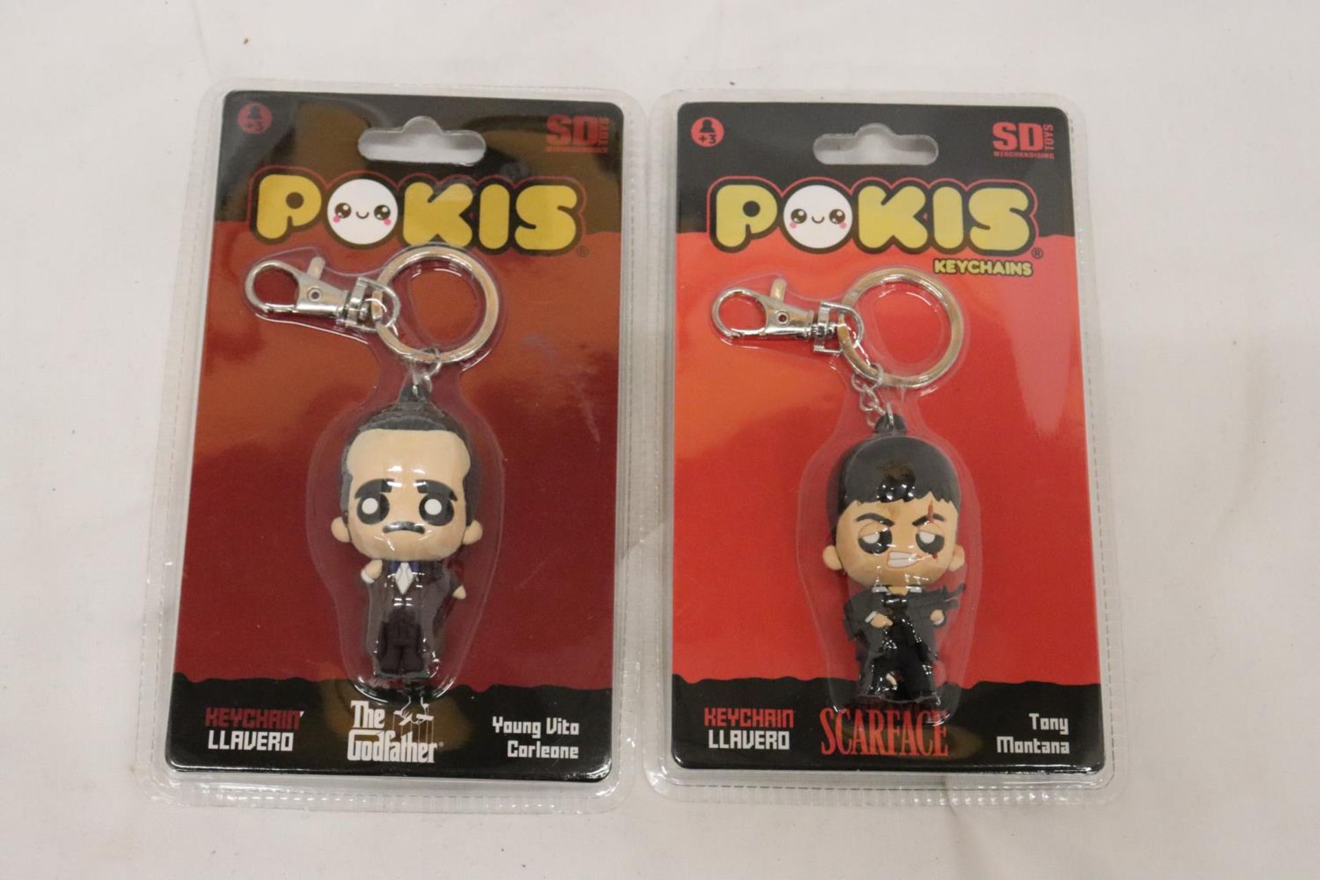 TWO COLLECTABLE 'POKIS' KEYCHAINS TO INCLUDE THE GODFATHER AND SCARFACE