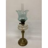 A VINTAGE OIL LAMP WITH BRASS BASE, CLEAR CUT GLASS OIL RESERVOIR, TURQUOISE SHADE AND GLASS FUNNEL