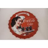 A LARGE COCA-COLA METAL BOTTLE TOP ADVERTISING PLAQUE