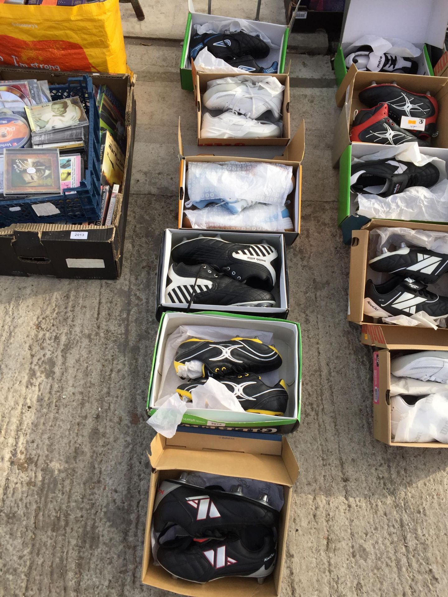 SIX PAIRS OF AS NEW AND BOXED SPORTS BOOTS AND TRAINERS