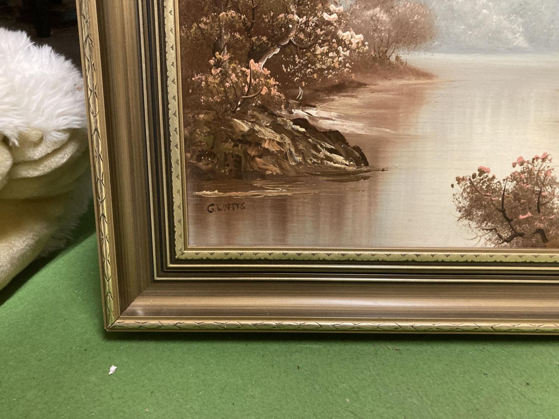 A GILT FRAMED OIL ON CANVAS OF A LAKE SCENE SIGNED G WATTS 73CM X 25CM - Image 2 of 2