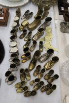 A LARGE QUANTITY OF BRASS, WHITE METAL AND PEWTER BOOTS