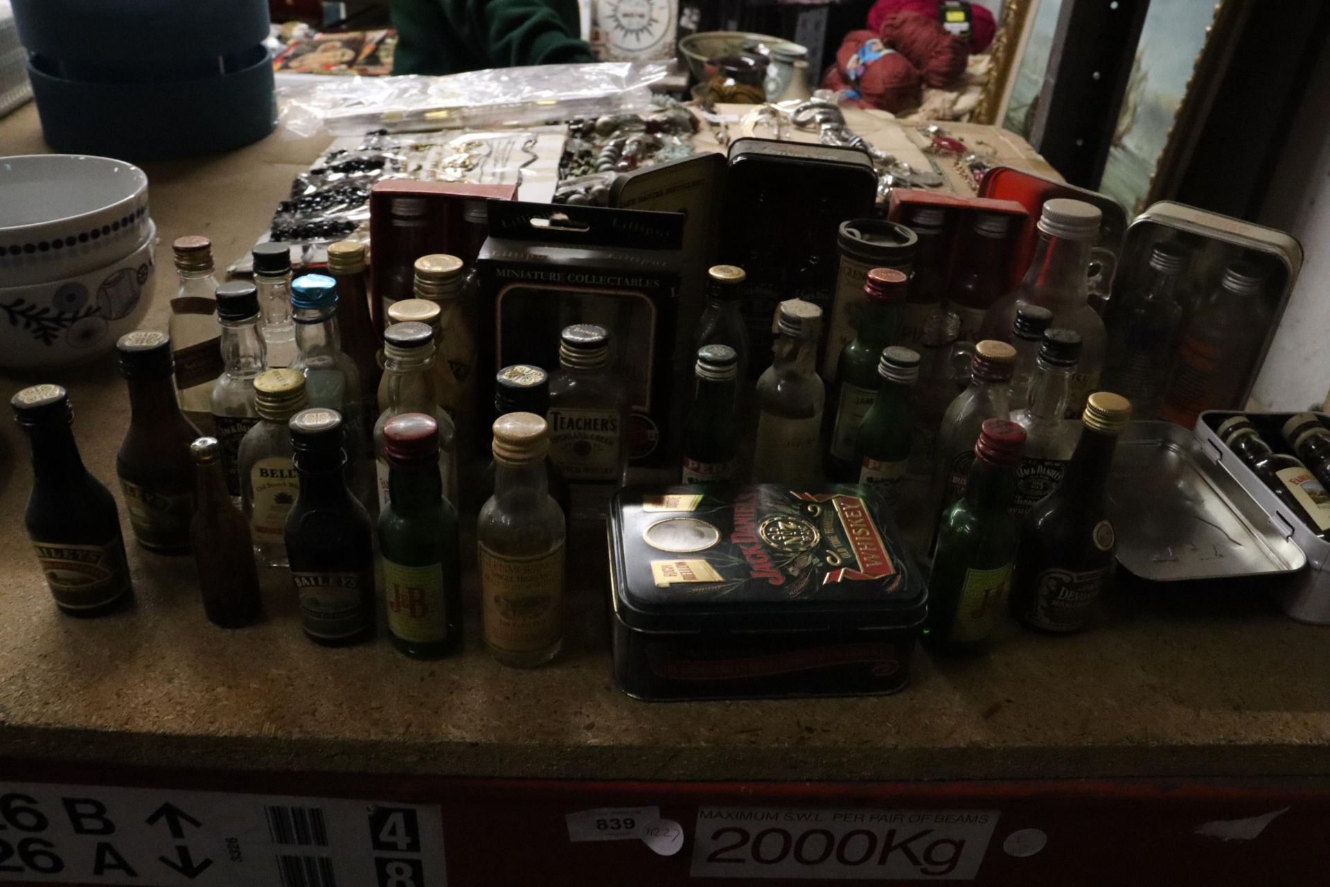 A LARGE COLLECTION OF EMPTY MINIATURE SPIRIT BOTTLES AND TINS