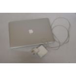 AN APPLE MAC BOOK PRO WITH CHARGER, VENDOR STATES THIS HAS BEEN WIPED AND IN WORKING ORDER - NO