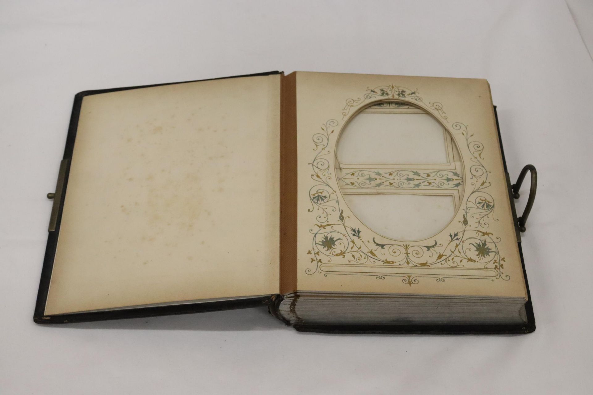 A VICTORIAN LEATHER BOUND PHOTO ALBUM WITH A WHITE METAL SHIELD SHAPED CARTOUCHE TO THE FRONT COVER - Image 2 of 6