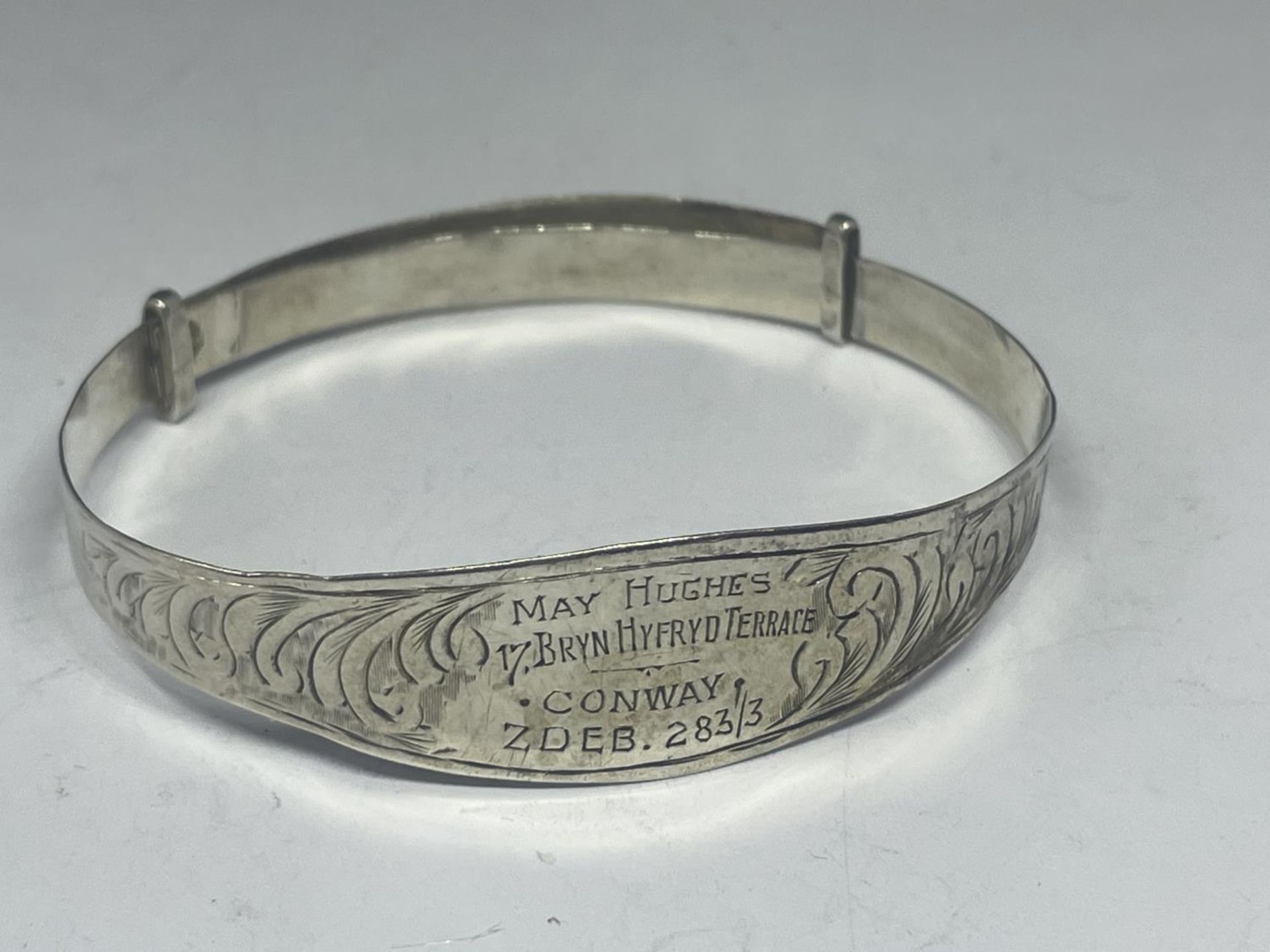 A SILVER BANGLE MAY HUGHES, 17 BRYN HYFRD TERRACE CONWAY