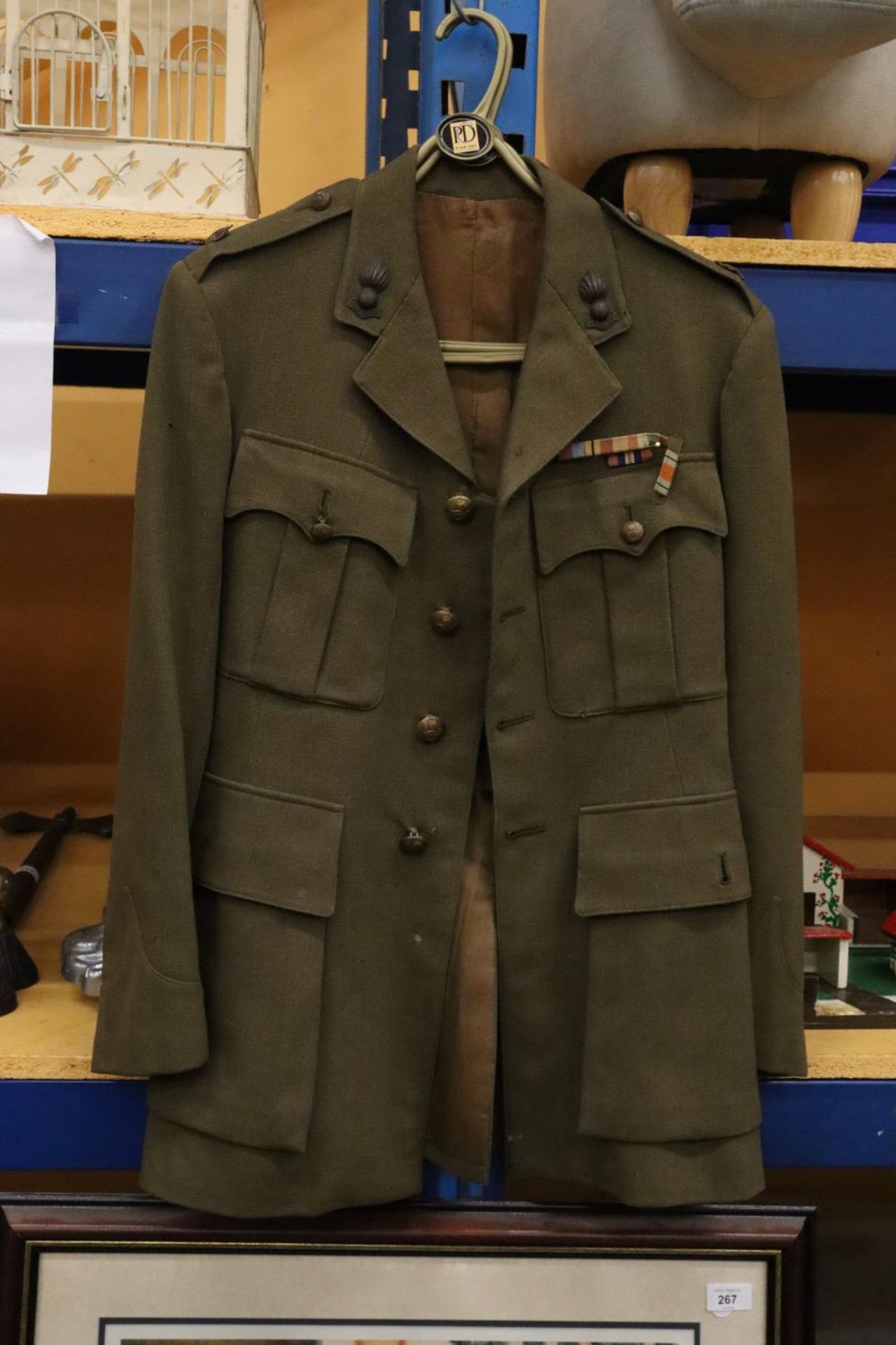 A ROYAL ARTILLERY MAJOR'S JACKET WITH SECOND WORLD WAR MEDAL RIBBONS