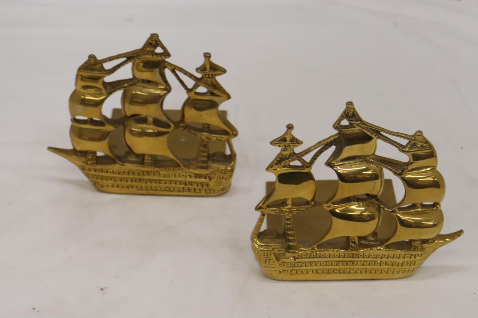 A PAIR OF VINTAGE BRASS SHIP BOOKENDS