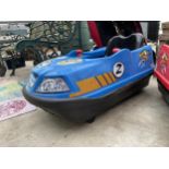 A BLUE BATTERY POWERED CHILDS BUMPER CAR