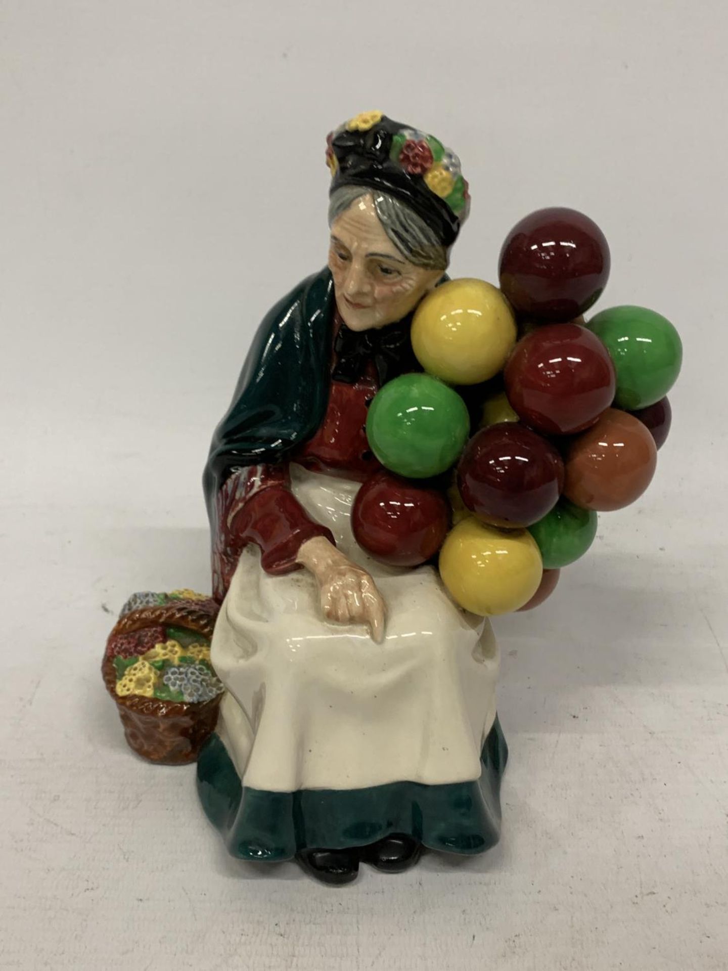 A ROYAL DOULTON FIGURE OF "THE OLD BALLOON SELLER" HN 1315