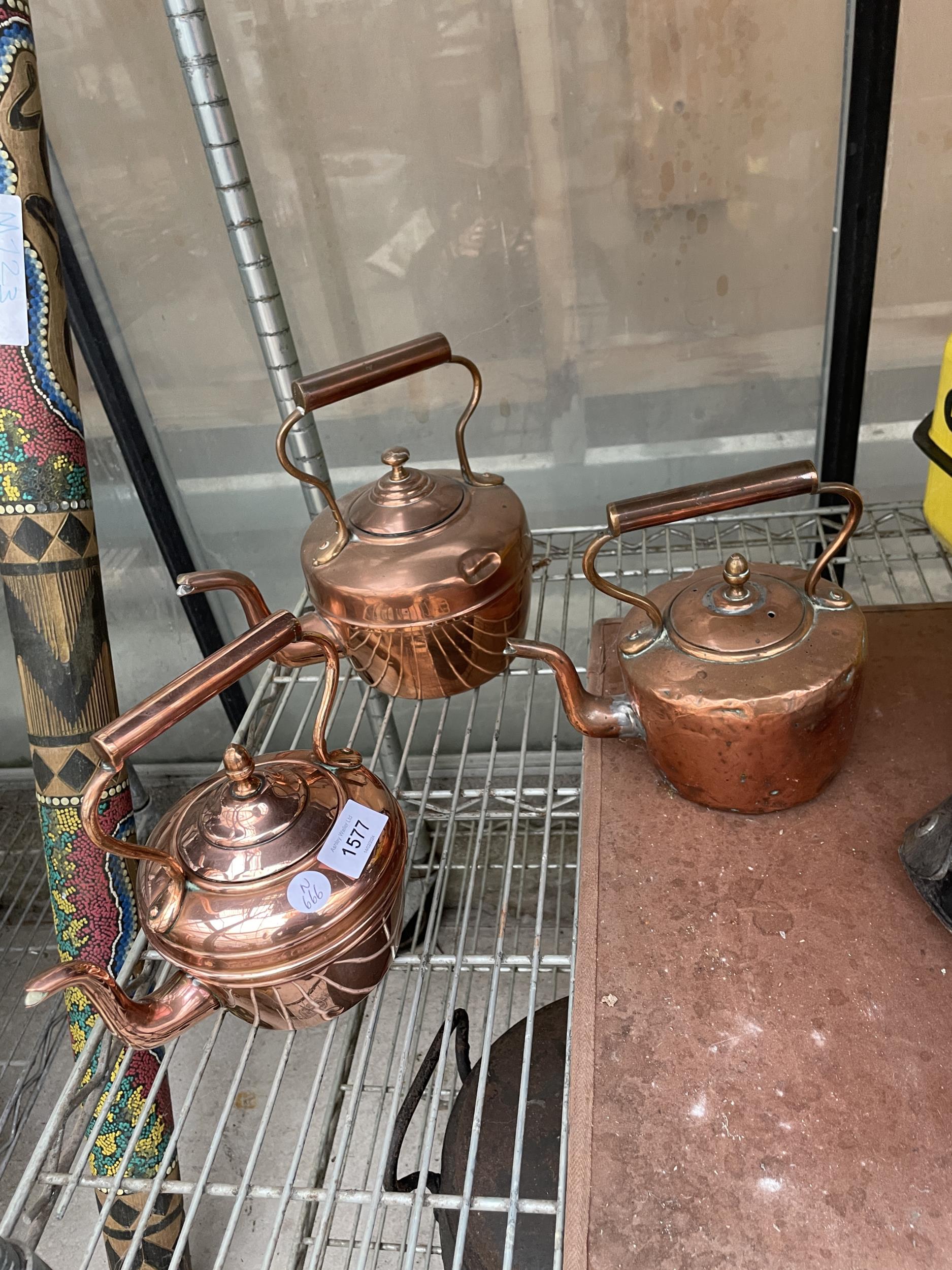 THREE SMALL COPPER KETTLES
