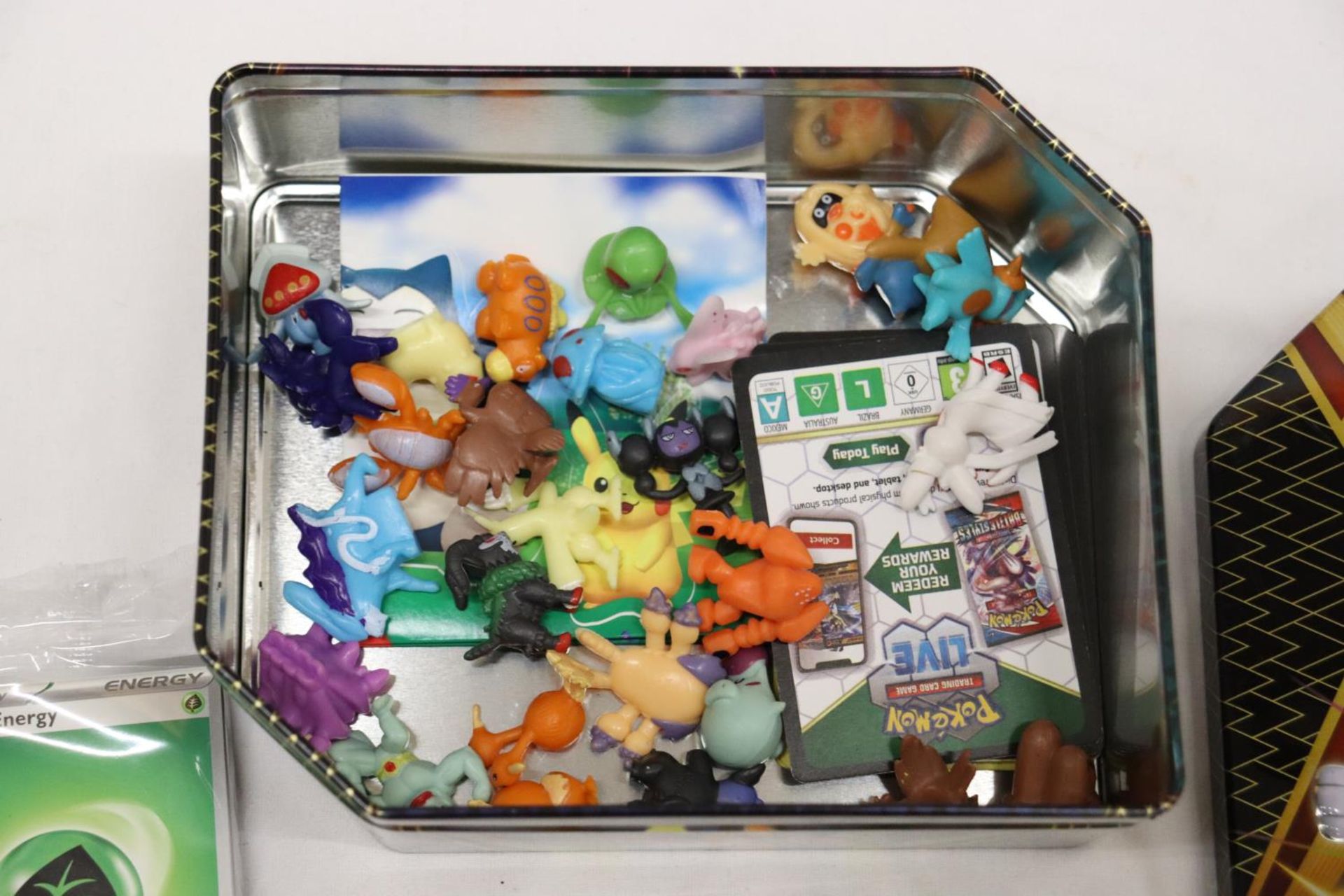 A TIN FULL OF POKEMON, TOYS, STICKERS AND CHARMS - Image 2 of 5