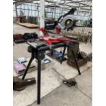 AN EINHELL TC-SM2131 DUAL COMPOUND MITRE SAW WITH BENCH